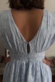 I bought this dress for a wedding that I'm a bridesmaid in, and although it should have definitely zipped up (see photo), the zipper would not go past the seam at the waist. For those of us who shop regularly on Lulus, this is a familiar issue. Not every dress will be like this, but mine was.
As far as the actual dress, it fit well, and it was gorgeous, definitely on the thicker side, and I probably would have been sweaty for the summer wedding. The bust was good on me and supportive (34C/32D). The dress was more empire-waisted than the photos show, but that's not necessarily a bad thing. - Isabelle L.