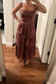 Loved the front of the dress, but there is a seam in the back on the top tier that lays super weird. I'm returning! - Amanda T.