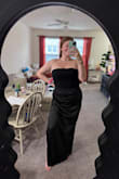 I absolutely love this dress! I was a little nervous about going strapless since I have a larger bust, but it feels surprisingly secure and supportive without constantly adjusting. The fit is so flattering, especially around the midsection, it smooths everything out in the best way and makes me feel confident (even after a little food baby or champagne belly =H). The fabric and cut are super elegant, and it's one of those dresses you can wear comfortably all night while still looking amazing. 

I will say there is a little muffin top situation for the side boob, but boob tape works magic!! STILL SO FLATTERING AND HOLDS EVERYTHING IN!! Highly recommend! - Sarah O.