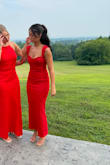 I wore this dress to a wedding and I loved it! The fabric is thick and hides any lines from undergarments. It does fit true to size: however, I have a smaller chest so I did tend to find the straps would fall down. This wouldn't be a problem for people with more of a chest! I felt beautiful and I loved the vibrant color. - Lauren C.