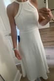 Oh, this dress is sooo pretty! I'm 5'8 and it's more of a tea length on me, which looks so nice. I am usually between small and medium size but opted to try the small. I think it's going to work because the back is mostly open. I have a small chest, so I can get away with it, but if you have a bigger chest, I would go up a size - Tiffany