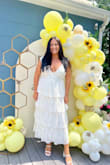 I ordered this dress to wear for my bridal shower! I ordered a size L; it fit a tiny bit loose, but I wouldn't change sizes. It was very stretchy. I got so many compliments! - Laura D.