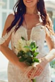 I ordered this dress for my wedding but I was skeptical. It was perfection right out of the box. It fit like a glove. I couldn't imagine a more beautiful dress for my wedding. - Angela W.