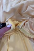 I just received this item in the mail today, and upon opening it, I realized that the hook at the top of the zipper came broken. On top of that, I was unable to zip it all the way because the zipper kept getting caught right at the waist seam. Overall, disappointed because it was such a pretty dress. - Sabreena J.