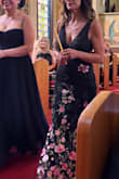 This dress is stunning! Unfortunately, if you pay attention to the pictures, you'll see that the placement of the flowers is random. I ordered many dresses to avoid getting a big rose on my belly button area or odd placement. Whatever company puts these dresses together, pay no attention to placement of pink roses. Having said that, I found one that was fine, but I did order about three or four of them. I wore to a wedding that I was part of the ceremony as an aunt, received a lot of compliments, and felt very comfortable all day long. I'm only 5'1" and more a 3 inch heel, but did need to hem a few inches.
Size XS was perfect. - Maria D.