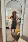 Wore this simple and sweet touch to a couple of museums. It is a thin, stretchy fabric, and per other reviewers, it does run very large. I am typically a small to medium (depending on fabric), but purchased (thanks, fellow Lulus reviewers!) an XS which still had a little room to spare. Be careful of any spills or sweating because camouflage is not in this dress's dictionary. I was outside for a few hours during my 1st museum outing, and "glisten" was very evident. Overall, I enjoy the cut and lightness of the dress. - Talysia E.