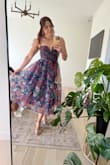 This dress is so beautiful. Ordered a medium based on reviews, and it fit great. I'm smaller chested, so I did use sticky inserts to help lift the ladies and hold in place. I wore it to a wedding, and I received so many compliments. I would definitely wear this dress again! - Corin F.