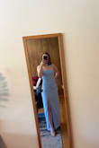 I love this dress. I am usually between a S/XS and the XS fits me better. The S was too big in the chest/shoulders/bust area with the straps falling off me. The XS might be a smidge tight in my hips/booty but the dress actually does have a little stretch to it so I like the XS fit better. It has room in the thigh area which is great for me since I have more athletic thighs and that's where I carry more weight. I'm planning to wear a strapless bra with it but it can be worn without one. - Madolyn M.
