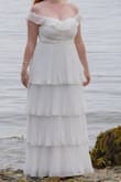 I had been looking for an off-the-shoulder, pleated, tiered wedding gown (similar to 50s style tiered wedding gowns), and this was exactly it! The material was super comfortable and flowy, the construction of the gown was very good, and there was a lot of attention to detail (slight boning in the bodice for shape, full coverage built-in slip). As someone with a 10-inch difference between my bust and my waist, I have a lot of trouble finding good dresses that fit both comfortably. This dress fit like a glove the first time I tried it on, and all of my guests thought it had been tailored to me! I felt so beautiful and timeless in this dress, and it was such a good price!! I highly recommend this dress, in any color! Gorgeous for every occasion. And fast shipping! I felt like a princess. :) - Mary G.