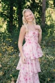 My daughter loved it for her senior photos but, runs small.  We left it unzipped from the waist up and tucked the material in sides.  (Not ideal but, didn't show in pictures). Material feels a little like plastic. - Chris M.