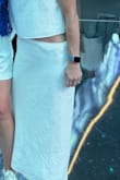 I needed a white outfit for the Backstreet Boys concert, and this fit the bill. There is a zipper and some elastic in the waist, so no issues getting it on.  It fit loosely, could have been tighter. I paired it with the top that matches. It was cute & comfy, and I loved it. - Libby T.