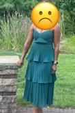 This dress would have been perfect, but it has extra material in the waist, and it creates a bubble. It doesn't matter what I do, I can stop it from happening. It is really awkward. - Nagner C.
