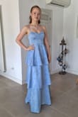 It fits perfectly. It's a little long, but with some heels, I think it will be perfect. A bit less shiny than the photo. Colour is a little darker - Stella S.