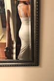 The dress was beautiful. It consists of stretchy material that just slides comfortable over your body. Very comfortable to move in. I loved it and would highly recommend it. Very satisfied. - Jennifer A.