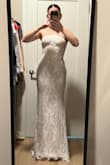 Dress is super pretty, the boning in the corset part of the dress was bent, so I'm hoping it will flatten while hanging. It could be SLIGHTLY tighter, but I think a size down would be too small. It's also very long, and I am 5'5. I am wearing really tall heels in the photo - Lexy E.