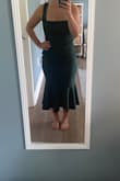 The dress is cute and would be flattering on the right body type. For me, I felt the length was odd with my height. (Even with heels) It also hit weird on my butt; it wouldn't lay flat against my lower back. The straps up top were too big. And overall would bunch up in odd areas. I chose the suggested size medium. I did return. - Kelly B.