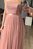 This dress looks exactly like the pictures. The sequins are well made and the color is a light pink. The length fits perfectly for me, and doesn't need alterations. I'm usually a size 2 in dresses, and the xsmall was too tight, but the small fit perfectly. - Sara B.