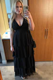 Bought this for a black tie wedding. You can't really wear a bra underneath, but I wanted to wear some inserts for cleavage help. So I wore a black bra under, and you could kind of see it at the very bottom, but it looked intentional. Without it, there's not much breast support. The waist was a little snug but not uncomfortable. It flowed perfectly at the hips. The straps have some cling to them, so they aren't moving much. In heels, I'm 5'9, and the length was almost perfect. I'll definitely wear this again! - Kaitlyn A.