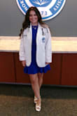 I wore this to my medical school white coat ceremony, and the modesty of this dress was perfect. I felt comfortable and confident in this dress. The color looked amazing! - Macey S.