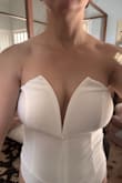 I wanted red, but it was only available in white and black, so I got the white. The fabric was thin, and because it was white, it was a little see-through (definitely need something for the nipples). The fit wasn't as great for me as others shared in their photos. The center wire that holds the top up didn't lie flat, and so it created this weird crease or buckling in the center just below my chest. Eventually, I think that wire would poke through the fabric--which already looked strained. I got a medium, but I don't feel like it was too big or small, although I did feel like I'd need to keep pulling it up, but that was mostly bc of the wire situation vs. it falling/sliding down. I don't think a small would've fit me, and a large would've been too big to stay up at all. Without constantly adjusting for that wire, I think it would eventually poke through. And that's a cardinal rule for me--it doesn't fit right if you have to keep adjusting it. So, unfortunately, had to return this. - Megan C.