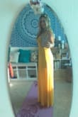 Shipment was very fast. The dress is beautiful. I was a little worried about it being see through, so I wore a slip under the dress. I needed a yellow dress for a fundraising event and I received many wonderful compliments that evening. I Will definitely be wearing it again. - Darchel M.