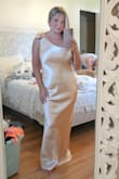 Very pretty. Make sure to steam out wrinkles, as it creases easily. If you're busty size up. The medium fit well everywhere but my bust, so I needed to size up.  I'm 5'2 and loved the length. I didn't need to get it altered. Taller ladies, it may not work for you. - Kimberly D.