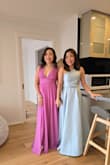 The material is chiffon-like and flows really nicely. It is a little long on me, but I didn't have it altered, I just wore a 3 in heels. It is a little tight around my chest, but it still zips fine. I did get a lot of compliments wearing it. - Christine S.