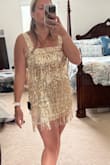 This is a cute party dress. Certain areas of the dress are stretchy except for the band around the waist. Bottom of the dress stretches a little bit in case you have athletic legs. - Michelle R.