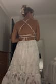 The fabric is lightweight and the pattern is very pretty! Perfect for a summer night out! I plan to wear this for a night out for one of my wedding events. I bought a size 4 and it fits perfectly. The back design is gorgeous, and I cannot wait to wear it this summer! - Marina S.