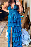 I absolutely loved this dress. I got sooo many compliments on it. 

I'm a 34D and had never gone braless before, but this dress made it so easy. I felt supported all night, even while dancing and jumping around. The built-in padding and structure kept everything in place perfectly. I didn't even use boob tape!

For length reference, I'm 5'4" and even with 4-5" heels, the dress was still too long (look at the mirror picture). On the way to the party in the Uber, my friend and I ended up cutting off the bottom tier, and it was honestly the best decision. You'd never know it was altered (see the last picture)! - Caitlin C.