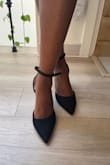I bought these to wear to a wedding. I found them comfortable, but since I was planning to wear them all night, I got myself Walter's ball of foot cushions. The strap is long even after wrapping it around my ankle twice, but I found a way to tuck it between the straps at the back. The straps are meant to go around the back of the foot first before you can wrap them in front, so no, you can NOT wrap them in front first. I like the suede look because it went well with my brocade dress. I usually wear US size 7 for strappy open toe heels, but US size 7.5 for closed shoes, so these fit perfectly. I also have skinny feet, but they did not look or feel too wide for my toes. - Maleeta D.