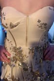 Half the sequins that were in the picture were not on the dress we received - Delinda K.