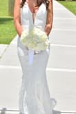 This dress is stunning. Fit like a glove .. just a little long-easy fix. My husband and I just renewed our vows and this was the perfect sexy wedding dress! - Nicole R.