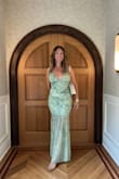 I received SO MANY compliments on this dress at a recent gala I attended. It fit very snuggly and perfectly everywhere except the bust (which I don't have much of, so I understand why!). It was absolutely breathtaking, and I felt so very beautiful wearing it! I sized down to make sure it fit like a bodycon dress, and I'm glad I did. - Heather M.