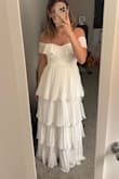 I'm so happy I bought this dress for my bridal shower! I was between an XS and S, but I'm so glad I went with the XS. Some of the reviews say the zipper breaks, which I can see how it would. You just have to be really careful when zipping it up! Other than that, it's beautiful, great quality too - it doesn't feel cheap. - Destiny G.