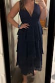 I love this dress! It is so cute and fits well. However, it runs small. I am a pretty standard large, sometimes medium. I sized up to a xl after reading reviews, and I'm glad i did. It's a little longer than I anticipated but not in a negative way. It's very comfortable and I'm excited to wear it! - Mallory H.