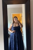 I loved wearing this dress all night! It was great in pictures, and I got a ton of compliments all night :). The fabric felt of quality, and the back corset is easy to manage. I didn't have to wear a bra either. Huge plus! IT HAS POCKETS!!! - Carley R.