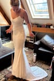 I'm AMAZED with the quality of the dress; it's extremely comfortable, soft, fits like a glove (other than being short and not wearing heels, so having it hemmed currently). I'm truly so in love with it. I never thought a dress I bought online for less than $150 could be this great! (I am standing on about a 5 inch stool) - Emmalinda C.