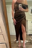 This dress ran very small for me. I'm a 34 A, so small-chested and I couldn't zip the medium up the side; it was so tight around my rib cage. If you're chesty, beware. No way it would fit true to size. Size up, it runs very small. Also, the slit is very high. The material was beautiful and looked expensive. I will be returning though. - Melissa W.