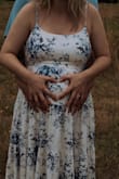 This dress is to die for! Literally the fabric is such high-quality thick material. I bought this dress for my maternity shoot and it was everything I envisioned and more. The straps are adjustable and since the back has the stretchy seam you see in the pictures, I got my normal size medium and it fit perfect. If I wasn't pregnant, I probably could've gotten a small, but honestly, with how much it's adjustable, I think it will still be ok after pregnancy. - Tessa H.