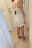 Different bust fit than the picture, more loose. Short and looks a little bit wide on the hips - Liat E.