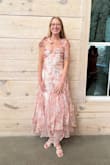 The dress is true to the photo, but it runs large in the bust and waist. I also can't get the wrinkles out no matter what. It arrived super wrinkled and I can't get them out. Go a size down. - Ashley M.