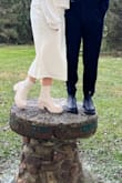 I wore these boots for my (very informal) outdoor, winter, wedding. I knew I would have thick socks & tights on, so I sized up a half size, and they were perfect. My feet were comfortable the whole time, and they were super cute! - Margaret W.