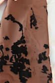 The right sleeve of the dress has a defect in the appliqué.
The dress came with a defect: the black print is missing, and the sleeve is missing the black flower appliqué. - Karina M.