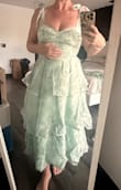 I purchased this to wear to my friend's rehearsal dinner as her wedding colors are sage/eucalyptus. It fits perfectly, and I love the bustier stitching, it even has some boning at the sides that makes it feel very secure.  The only negative is the zipper. It's super tough to get past the seam between the skirt and bodice. It's not because it's too tight, but instead because the stitching there is bulged. It's doable to hard! - Emily G.