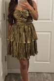 I honestly do like the dress, but for me personally, I do wish it was a little bit shorter in length. I also believe the picture used makes it look like a light gold, but it's actually like a more yellow-ish gold rather than a champagne-ish color. Overall tho, I do like the design! - Kamille B.