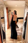 I bought this dress to wear as a guest to an October Texas wedding, and I'm so pleased with how it fits! With a medium heel on (no more than 3in), the length is just right and won't require any hemming (a small miracle for a short girl!). I love the low back and that it's contained enough to still be classy from all angles. My only comment is that I will probably use some fashion tape on the length of each side of my back to make sure the straps stay in place throughout the evening. I don't think it's absolutely necessary, but a precaution. - Paige B.
