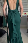 I ordered a size small and it fit perfectly. The quality is not cheap feeling at all; It is thick in a durable way, but not in a I'm gonna get so hot in this way. The fit and style are beautiful, and the bow is stitched down at the top lightly to keep it in place. I'm in love - Carley E.