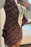 There was no possible way for me to get this buttoned. I ordered a size M. I don't know if an L would have fit. - NICOLE W.