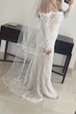 I loved how this dress was elegant, conservative, yet a little sexy. I ultimately didn't choose this as my wedding gown because I wanted my gown to appear more white in color. When I had it on, the gown had too much nude under the lace for my liking. It was flattering and true to size and loved the length of the tail. - Vanessa O.